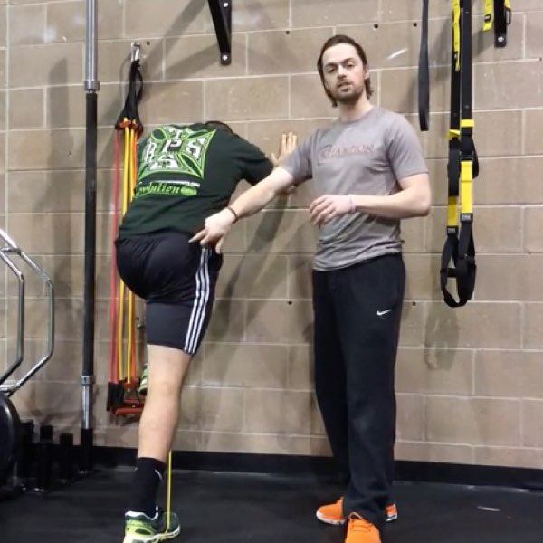 The Wall Iso Glute March Drill